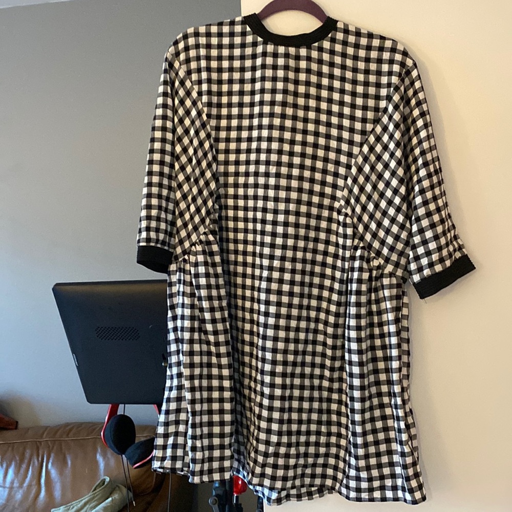 Buffalo plaid lil tunic in black and white. Versatile, stylish and comfy.
